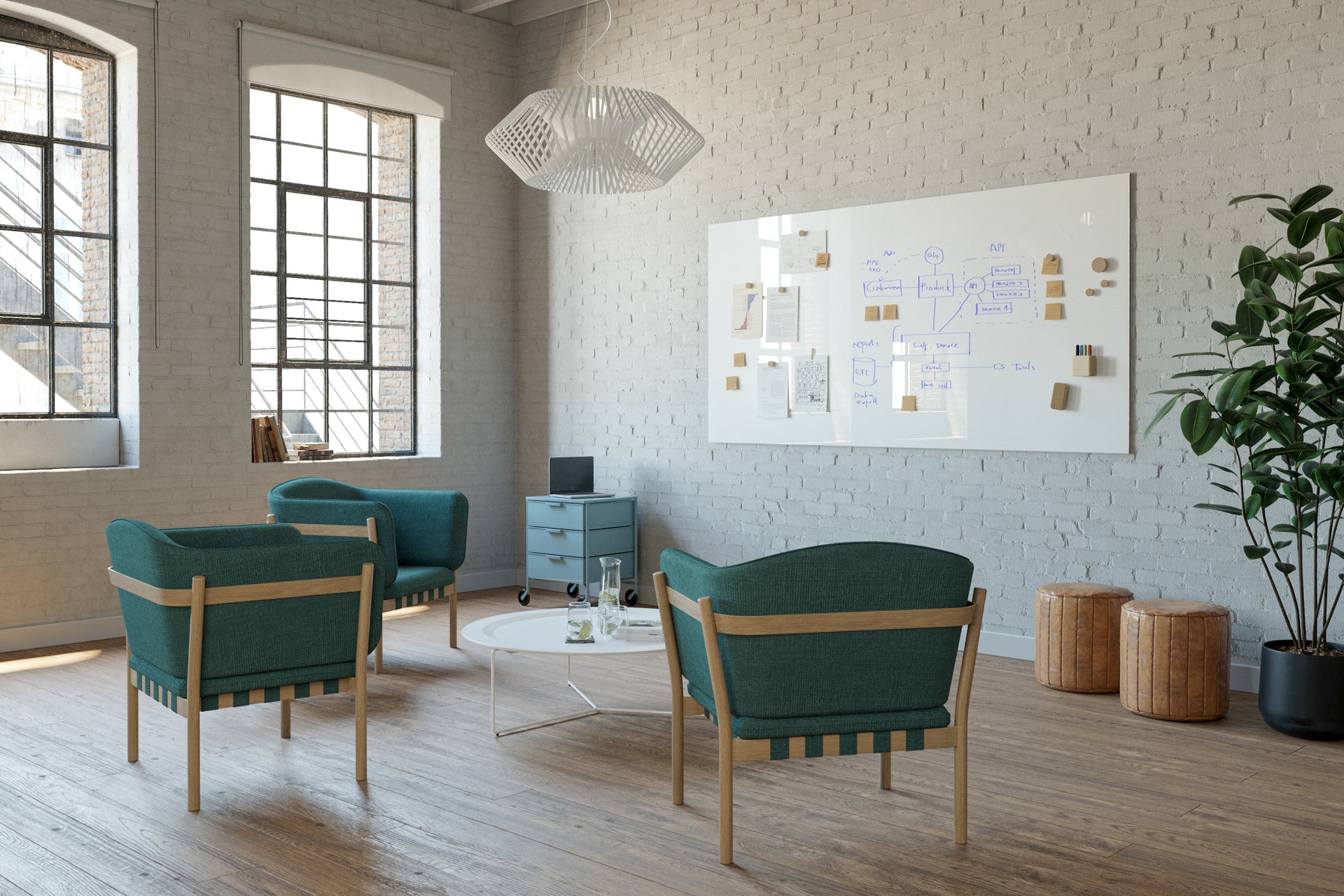 Studio loft with green chairs and glass whiteboard